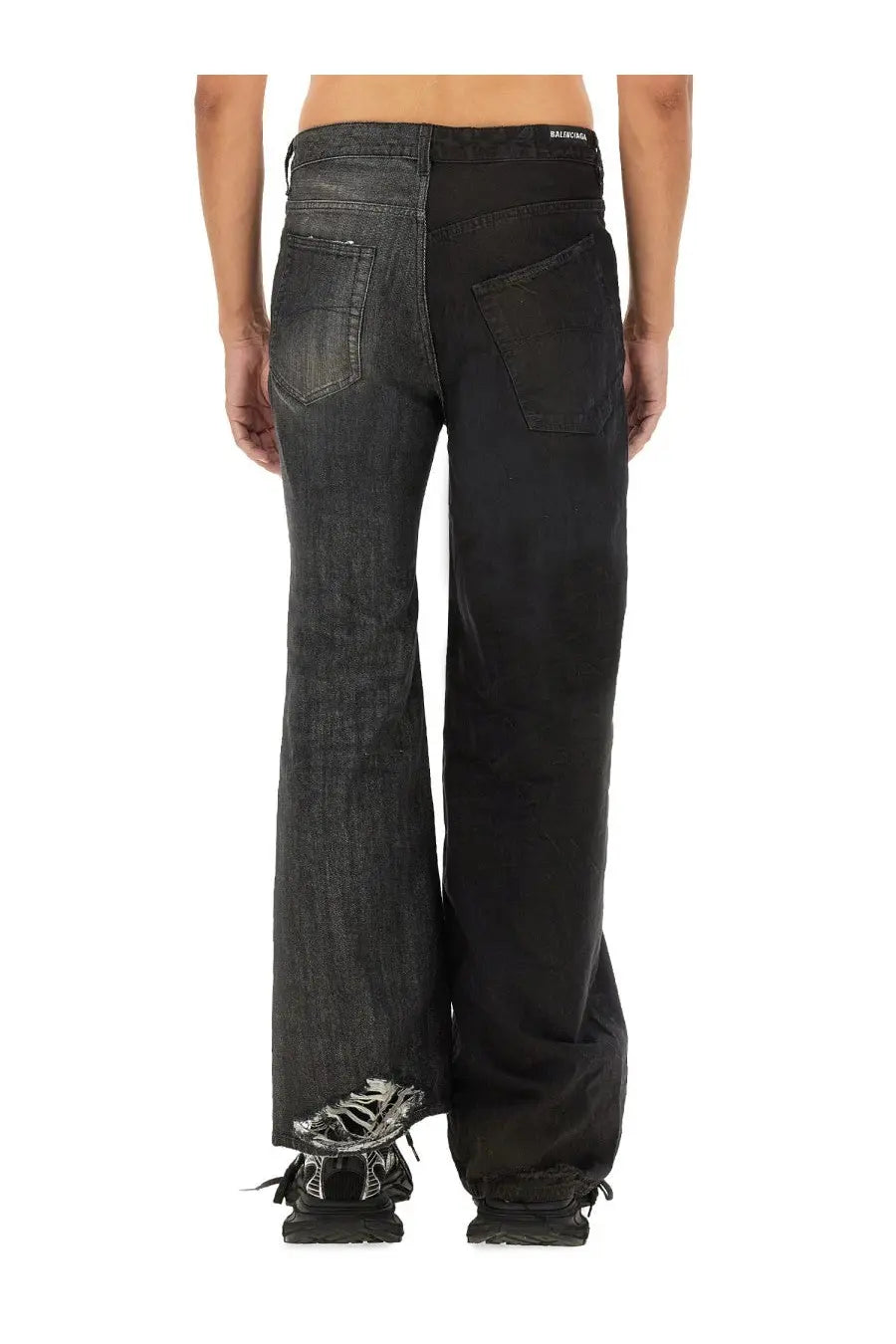 Back view of balenciaga men’s black denim fifty fifty jeans with split back design and distressed frayed hem