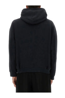 Balenciaga men’s black hoodie with relaxed fit and ribbed cuffs made from soft cotton fabric