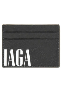 Balenciaga men’s black leather card holder with textured finish and bold white iaga lettering on the front