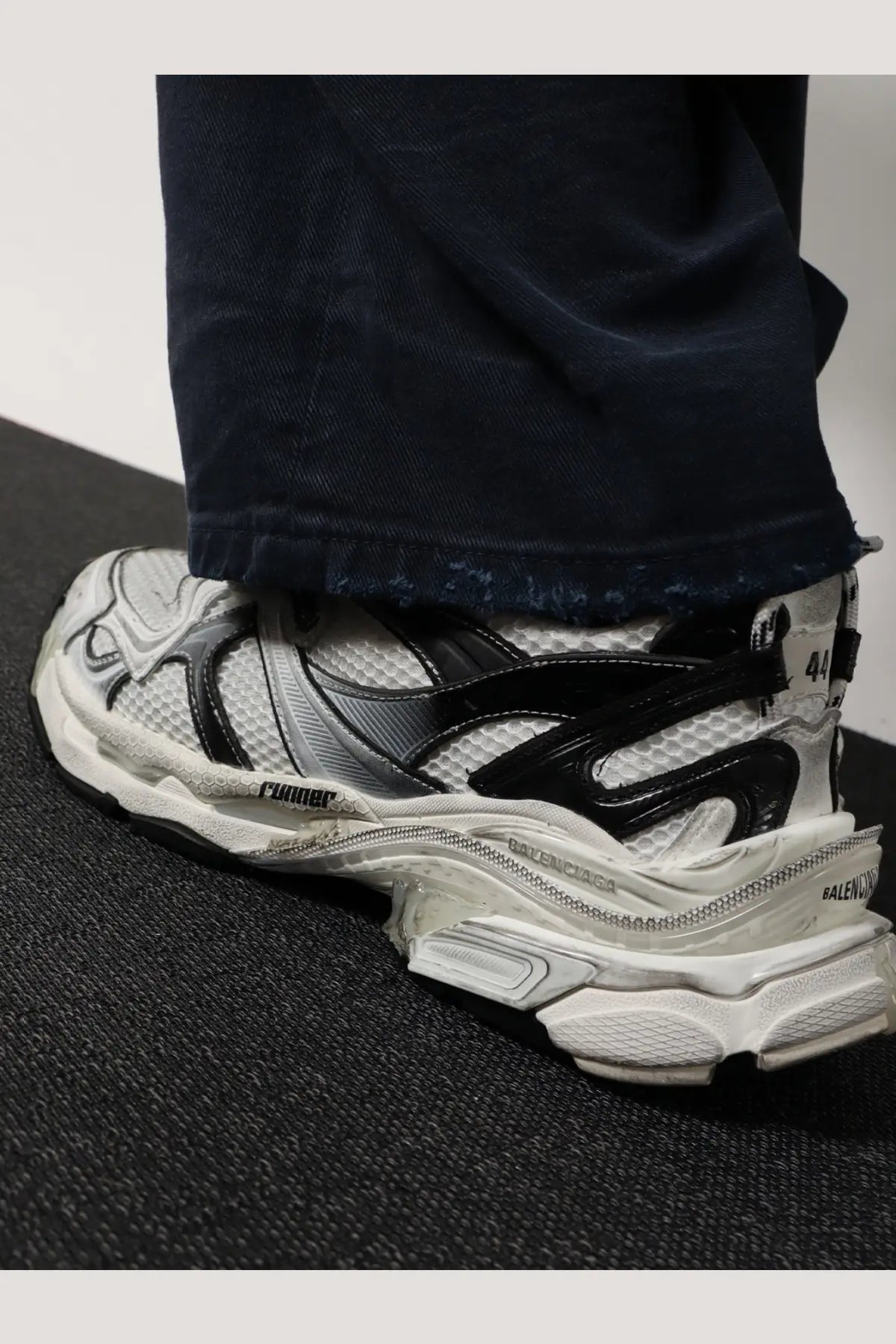 Balenciaga men’s mesh and nylon runner sneakers white with black detailing and chunky layered design