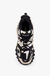 Balenciaga men’s mesh and rubber track sneaker in black and beige with a chunky layered triple s design