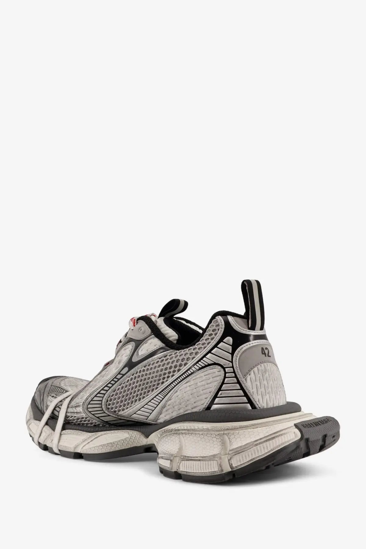 Back view of balenciaga men’s grey mesh sneakers with black mesh and chunky sole featuring balenciaga logo on heel