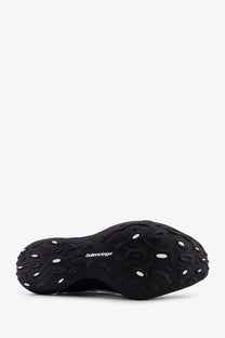 Balenciaga men’s monday ultra sneaker blue featuring a black textured sculpted sole with white circular accents