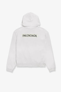 Back view of balenciaga men’s over zip up cotton sweatshirt hoodie in white with black lettering across the back