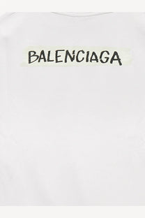 White balenciaga cotton t shirt featuring a black graffiti style logo printed across the chest