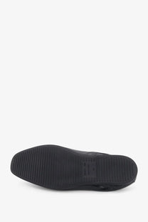 Black rubber sole with textured grip and embossed balenciaga label on balenciaga men’s palermo bb leather loafers black