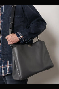 Balenciaga men’s rodeo messenger leather crossbody bag in black with silver-toned metal clasp