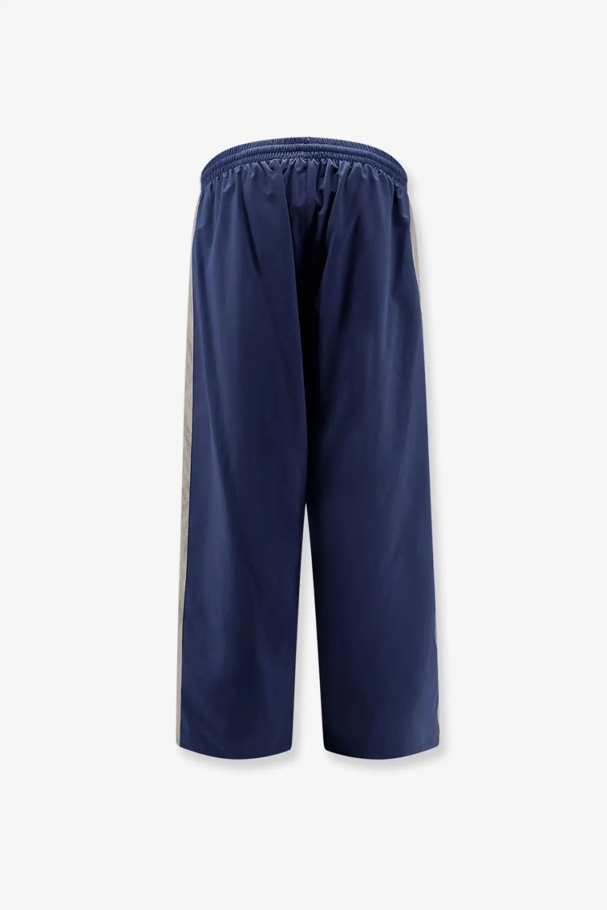 Navy blue Balenciaga men’s sporty nylon trousers with light gray vertical stripes down each side for activewear
