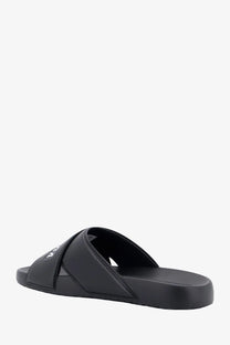 Balenciaga men’s sporty pool eva slide sandal in black rubber with a minimalist design and subtle white logo on strap