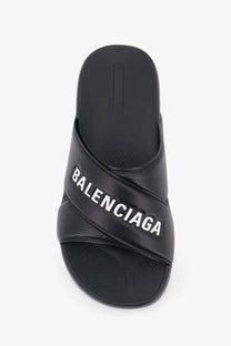 Balenciaga men’s sporty pool eva slide sandal in black with bold white logo on the strap