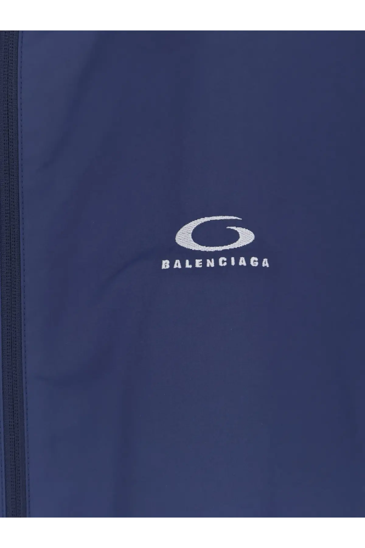 Navy blue balenciaga men’s sporty rain jacket with white embroidered logo and front zipper detail