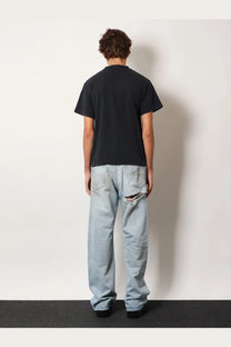 Black balenciaga men’s standard cotton shirt showing back side with subtle graphic and short sleeves