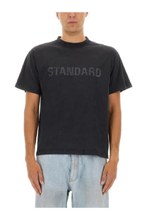 Balenciaga men’s black short-sleeved t-shirt with faded standard logo across the chest in cotton material
