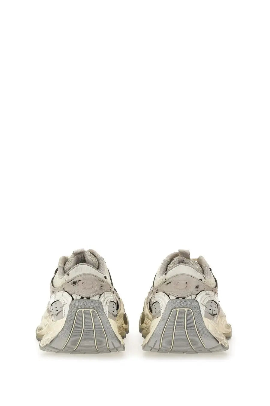 A pair of beige and gray Balenciaga men’s stapler sneakers with chunky layered design and triple s sole