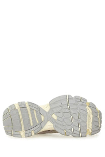 The shoe sole of the balenciaga men’s stapler sneaker beige features a chunky layered gray rubber and cream midsole design