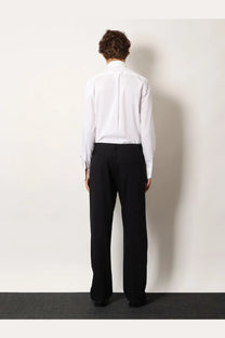 A crisp white long-sleeved dress shirt with classic collar paired with balenciaga men’s straight fit black cotton trousers