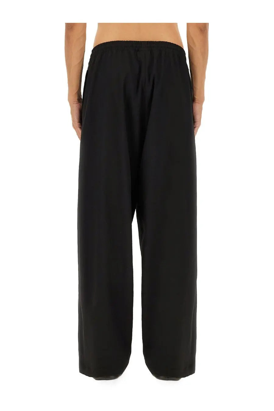 Black wide-leg Balenciaga men’s stretch pants with elastic waistband designed for comfort and style