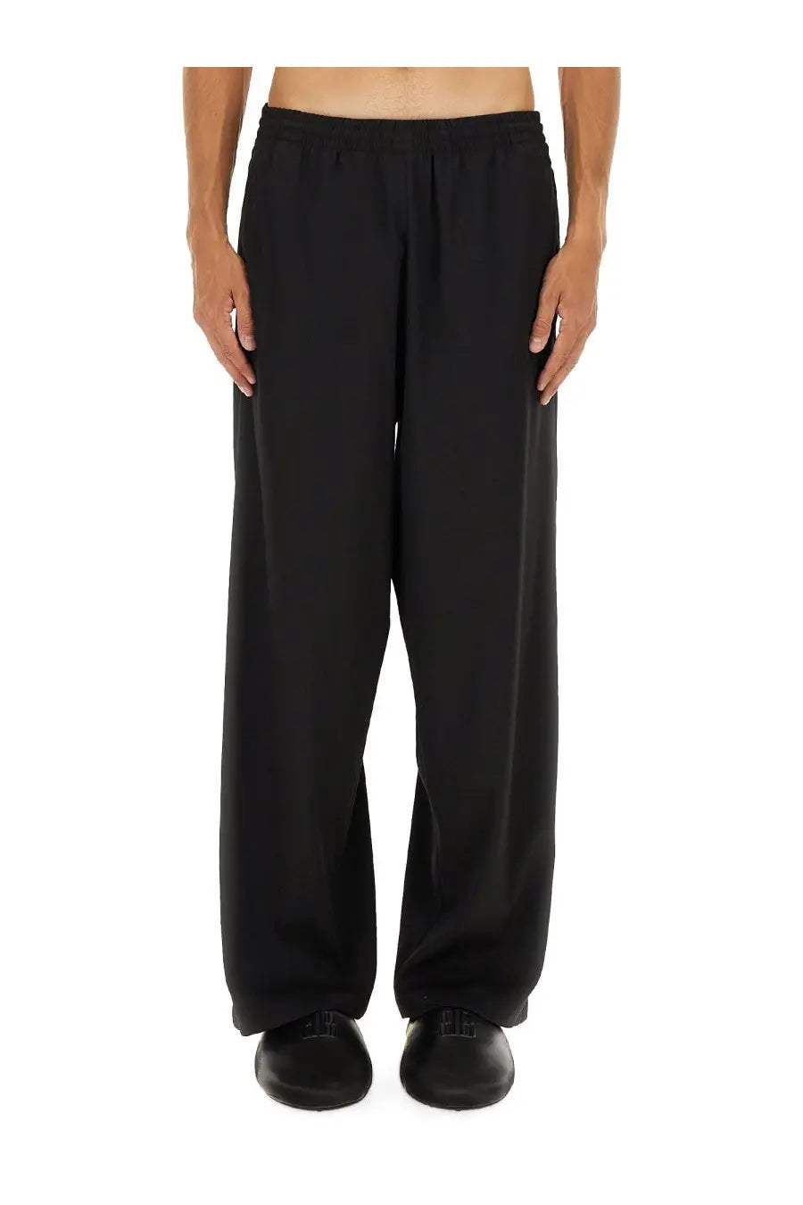 Balenciaga men’s stretch black wide-leg trousers with a relaxed flowing silhouette and elastic waistband