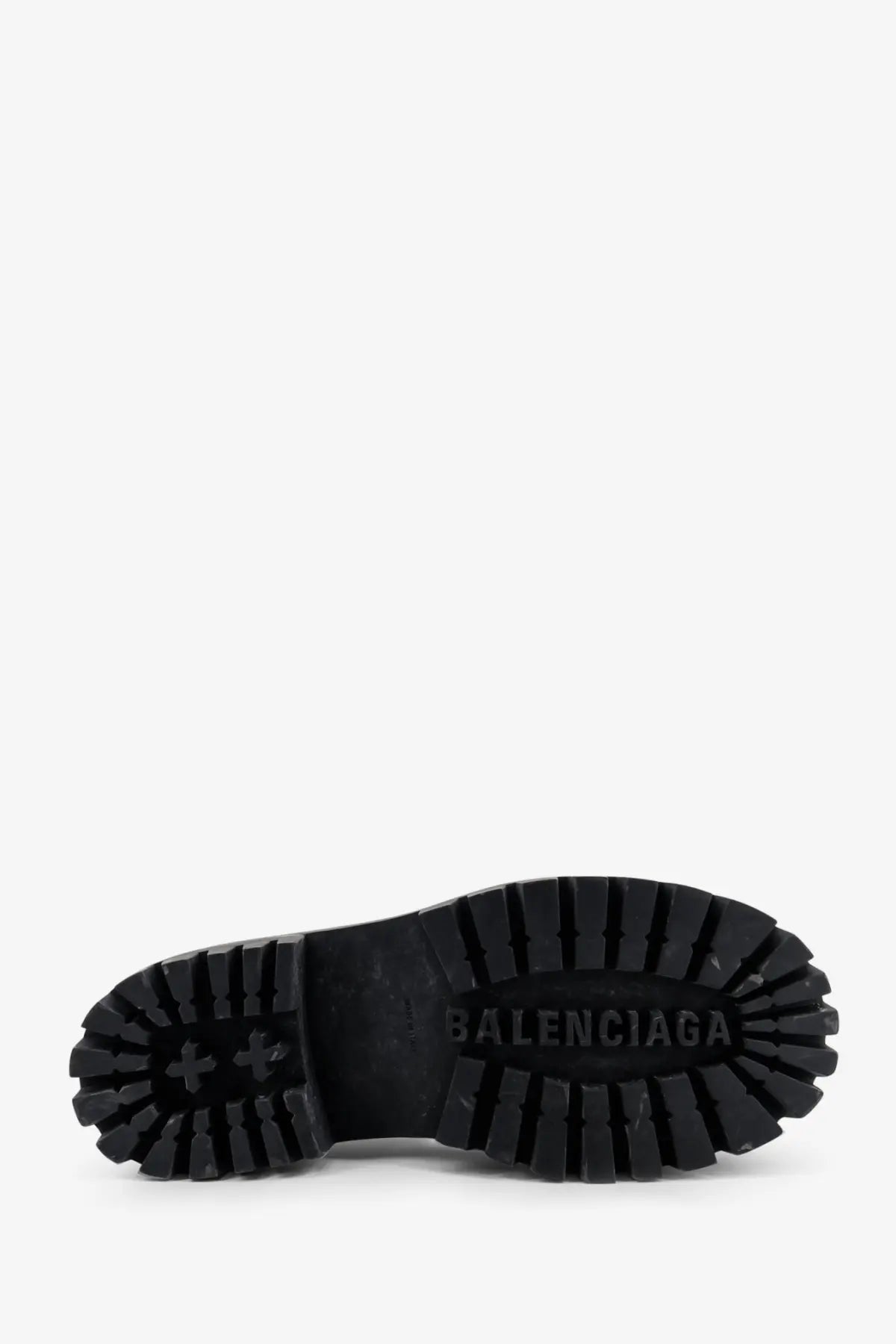 Black rubber sole with deep tread and embossed balenciaga logo on balenciaga men’s strike leather boots black
