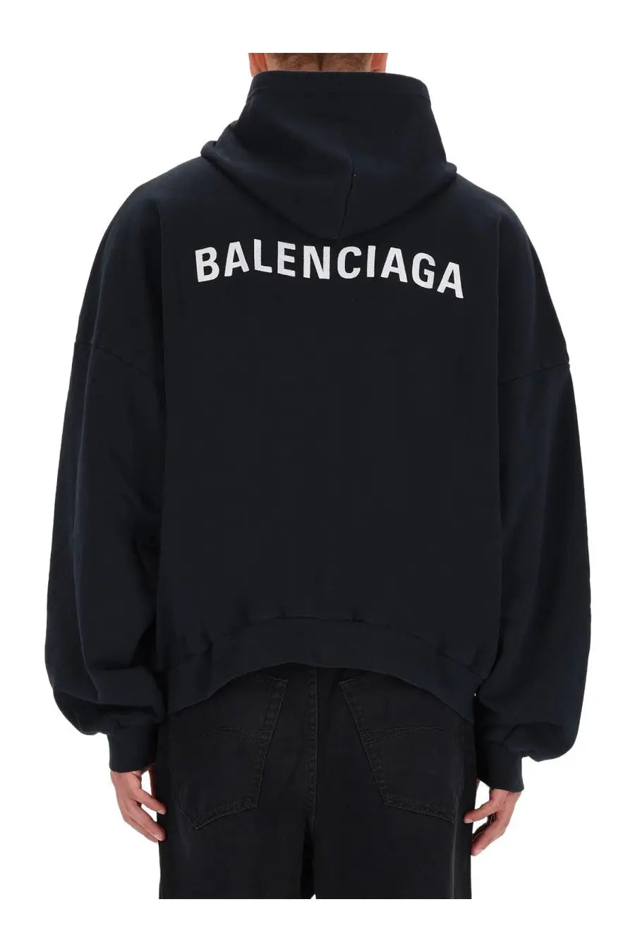 Back side of a black balenciaga men’s sweatshirt hoodie with bold white lettering across the back