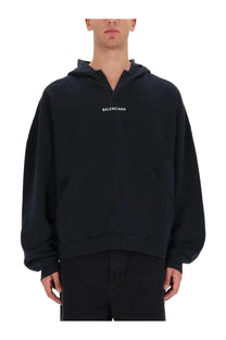 Balenciaga men’s black hoodie with minimalist white logo and relaxed oversized fit perfect for casual wear