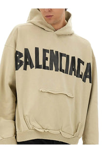 Beige balenciaga men’s tape type sweatshirt hoodie with bold black lettering and distressed frayed details