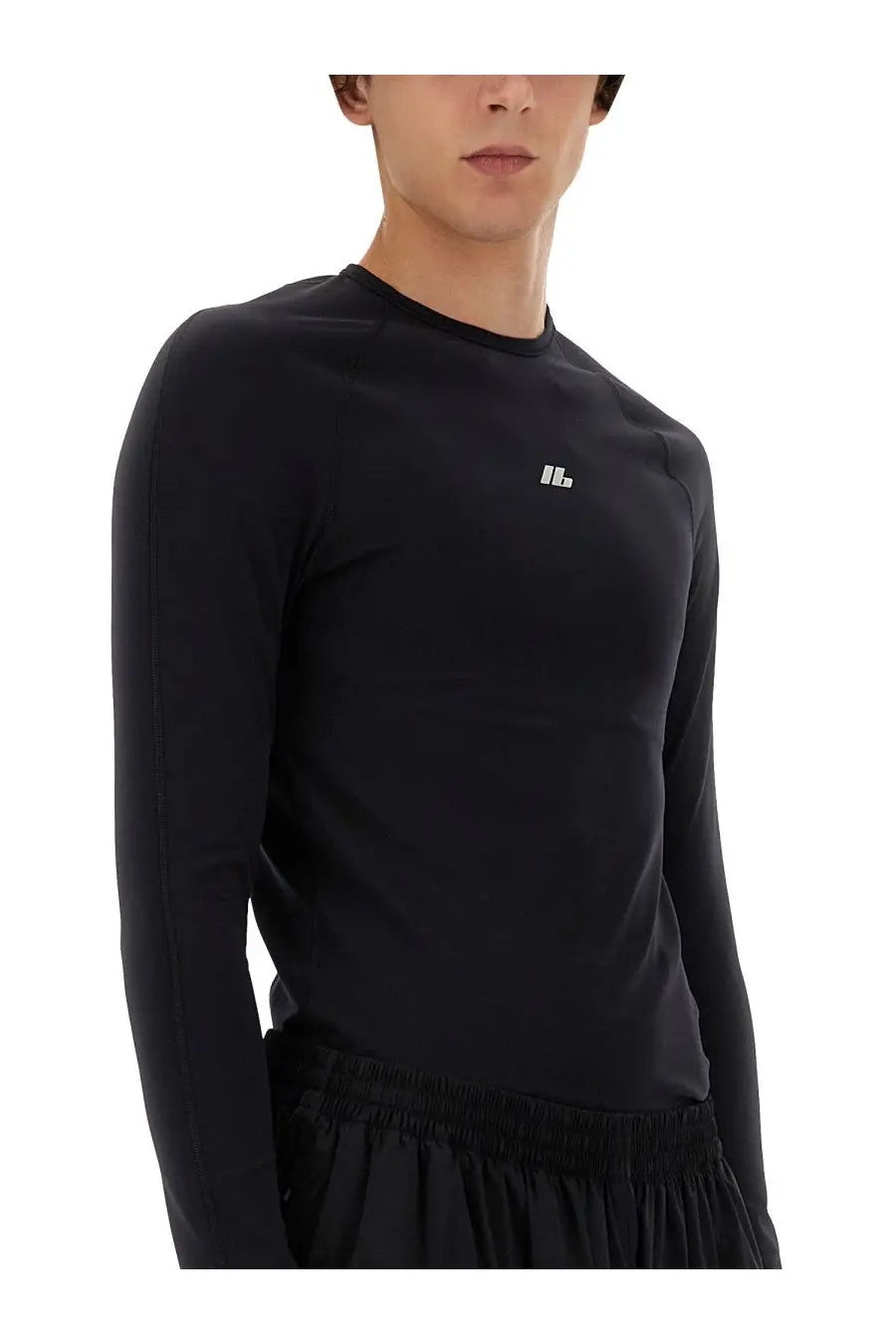 Balenciaga men’s black long-sleeved athletic top with subtle white logo on chest designed for performance wear