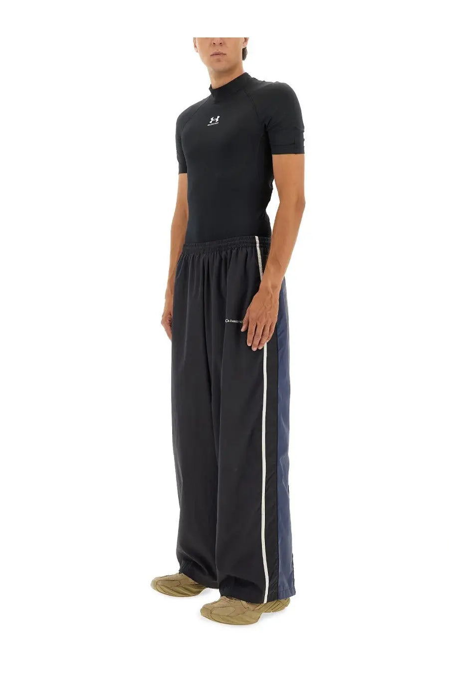 Balenciaga men’s tracksuit pants black with white side stripes and navy blue outer leg panel in athletic design