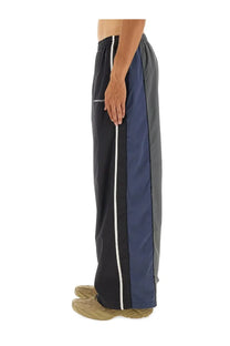 Balenciaga men’s black tracksuit pants in dark navy and gray with white side stripes elastic waistband and relaxed fit