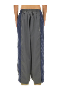 Balenciaga men’s black tracksuit pants in gray and navy blue with a relaxed wide-leg cut for casual wear