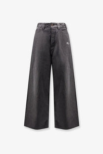 Balenciaga men’s dark gray wide-leg denim trousers with subtle white embroidered logo on the thigh