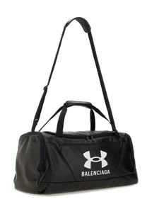 Balenciaga men’s under armour black duffel bag with white logo and dual handles for gym and travel use