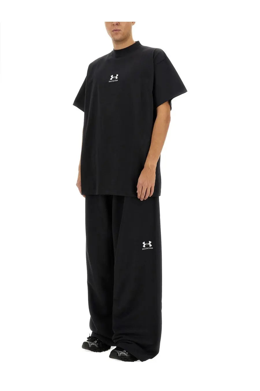 Balenciaga unisex oversize black t-shirt with white logo and matching black wide-leg pants with brand emblem