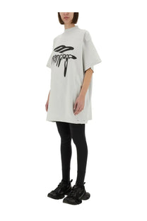 White oversized Balenciaga unisex shirt with black logo print made from cotton for casual wear
