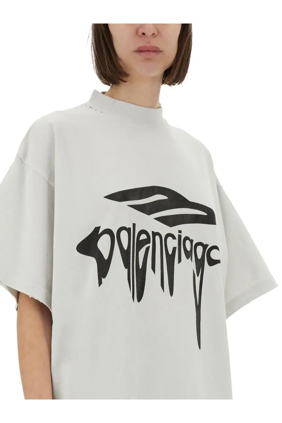 Balenciaga unisex oversize white t shirt with bold black graphic logo featuring a stylized bird and lettering