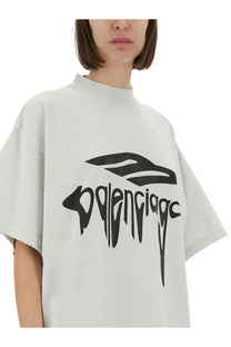Balenciaga unisex oversize white t shirt with bold black graphic logo featuring a stylized bird and lettering