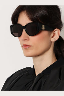 Balenciaga women’s black acetate cat-eye sunglasses with gold bb logo on the temple