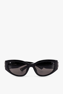 Black balenciaga women’s acetate sunglasses with sleek cat-eye frame and dark gray lenses