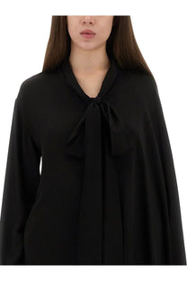 Balenciaga women’s black satin blouse with a flowing wide collar tied into a bow at the neckline