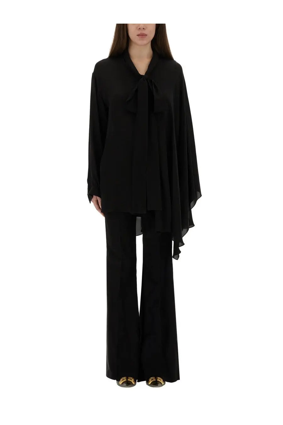 Balenciaga women’s black silk blouse with flowing asymmetrical design and tied bow at the neckline