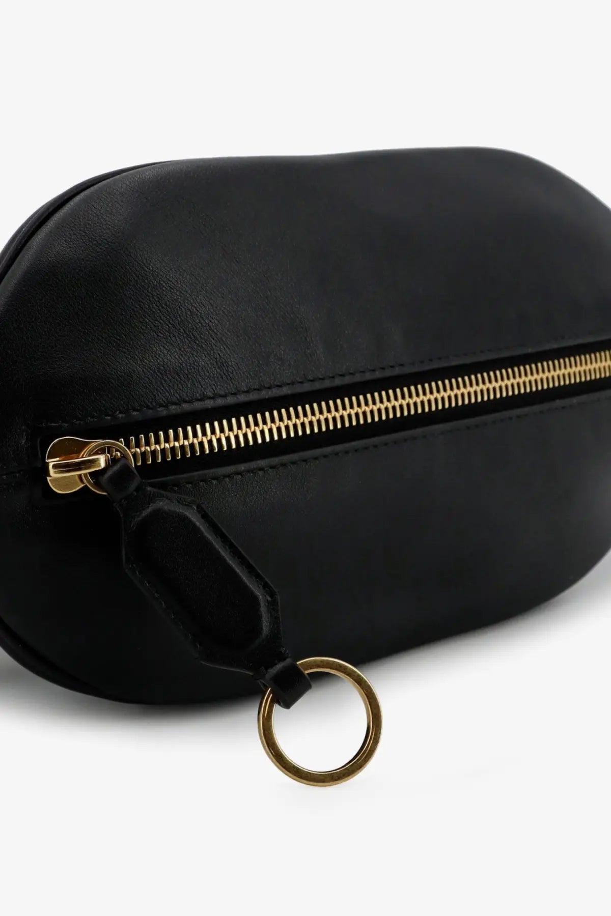 Balenciaga women’s black leather fanny pack with gold zipper and matching metal ring for stylish hands-free use