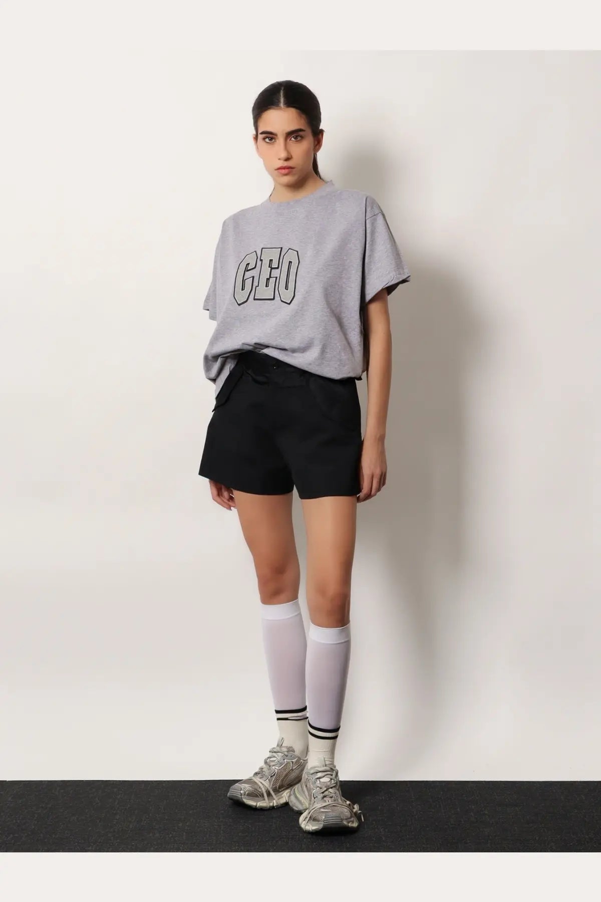 Balenciaga women’s grey boxy fit cotton t shirt with geo printed in bold black and white lettering across the chest
