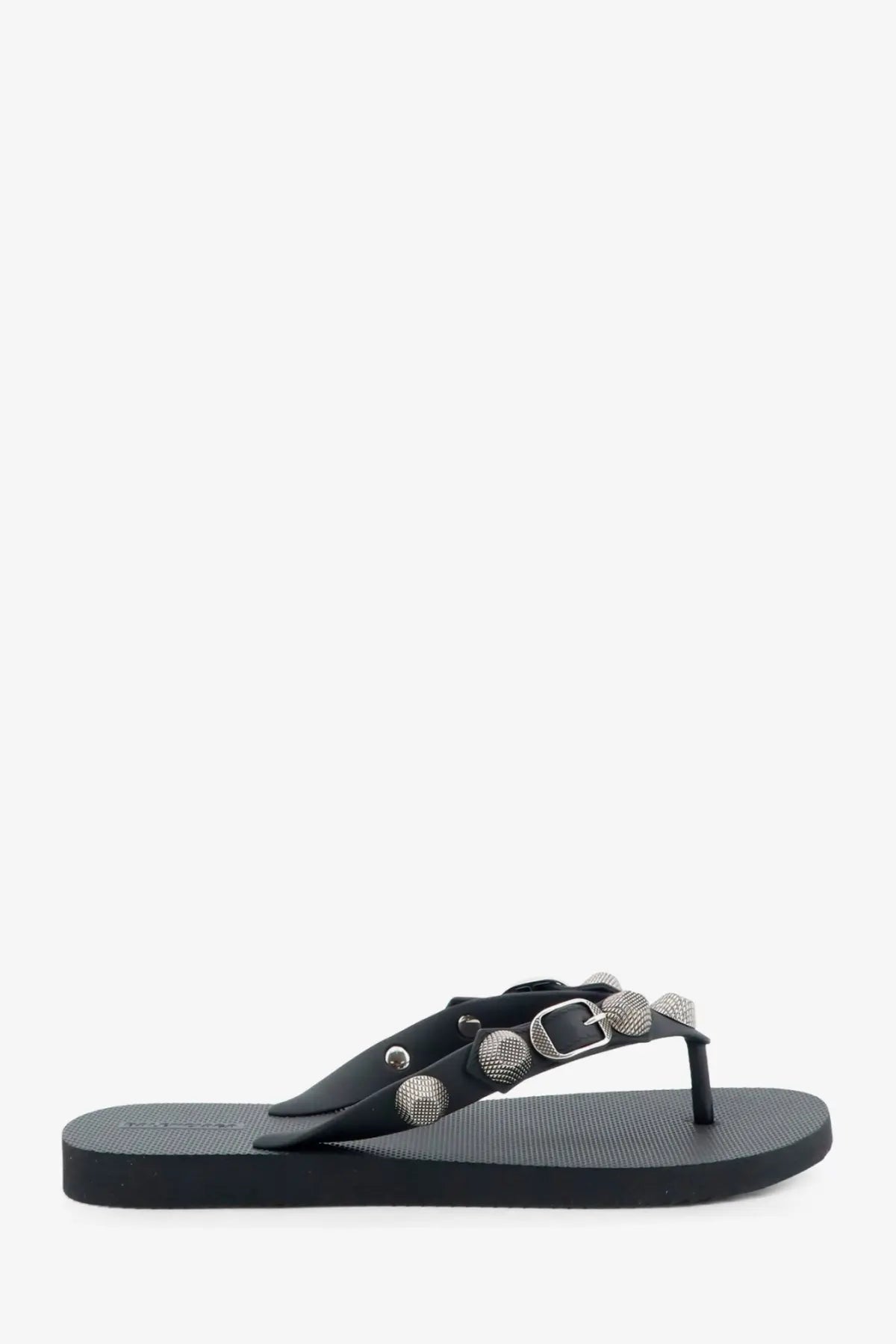 Balenciaga women’s cagole black leather flip-flop with silver-toned studs and buckle detail visible from the back