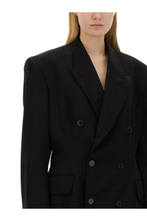 Balenciaga women’s black double-breasted blazer with structured shoulders and matte black buttons
