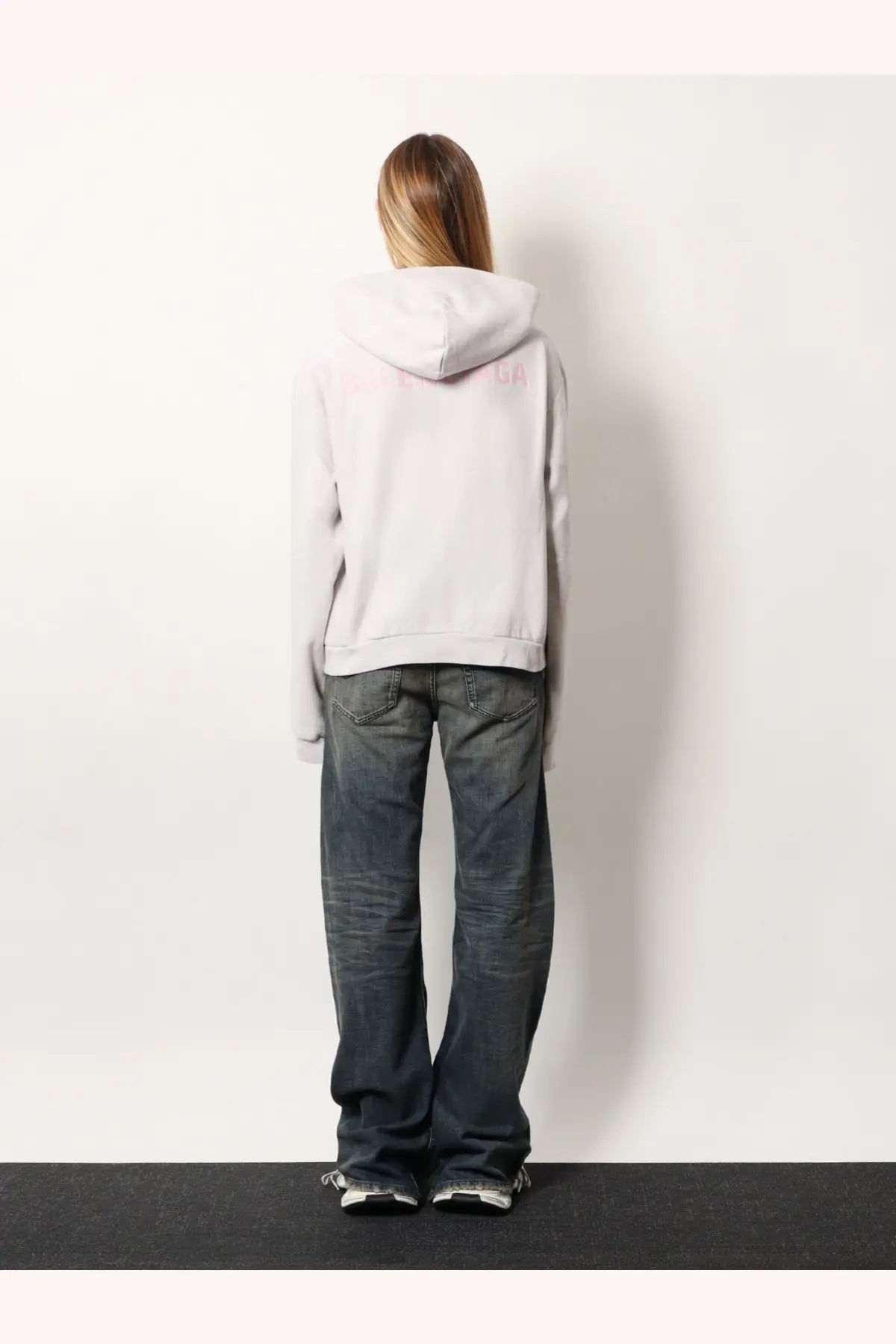 Balenciaga women’s cotton hooded sweatshirt white shown from the back with a soft light gray fabric and subtle pink logo
