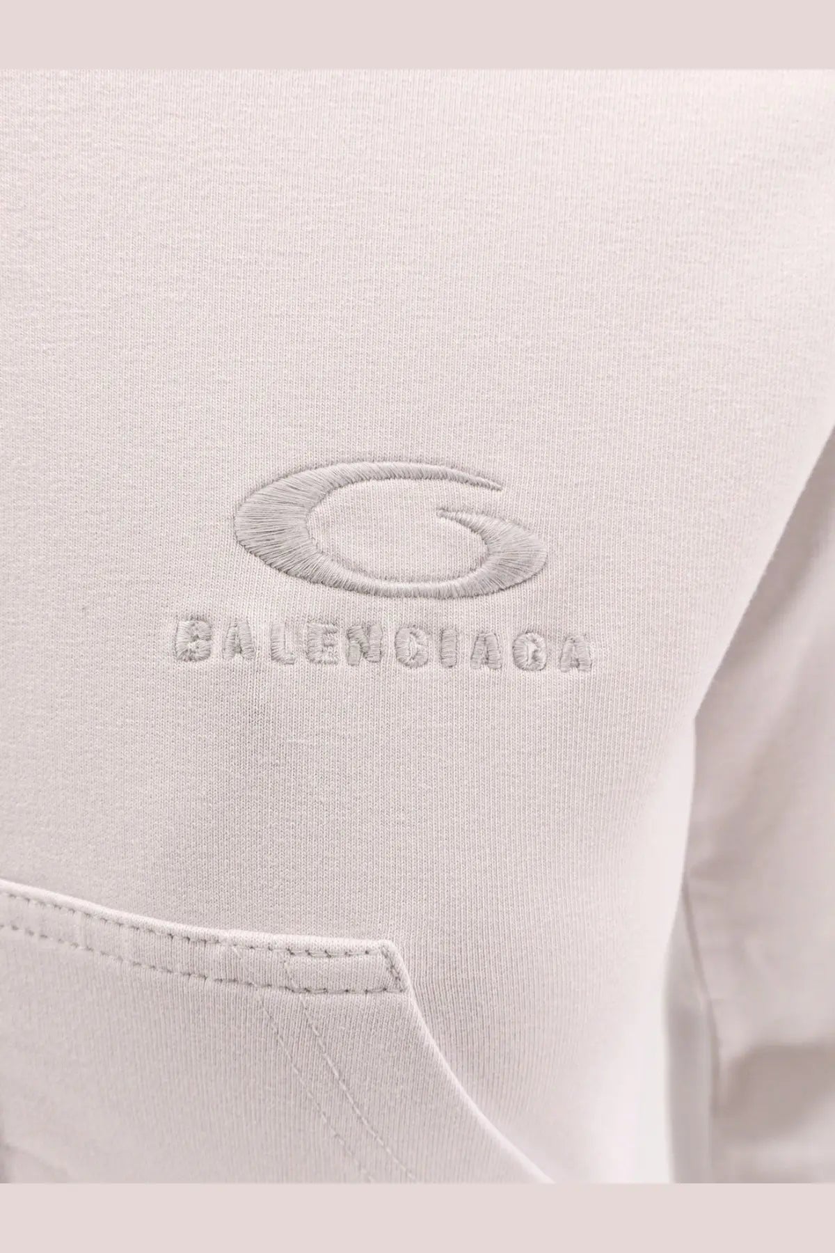 Balenciaga women’s white cotton hooded sweatshirt with subtle gray embroidered logo on soft off-white fabric