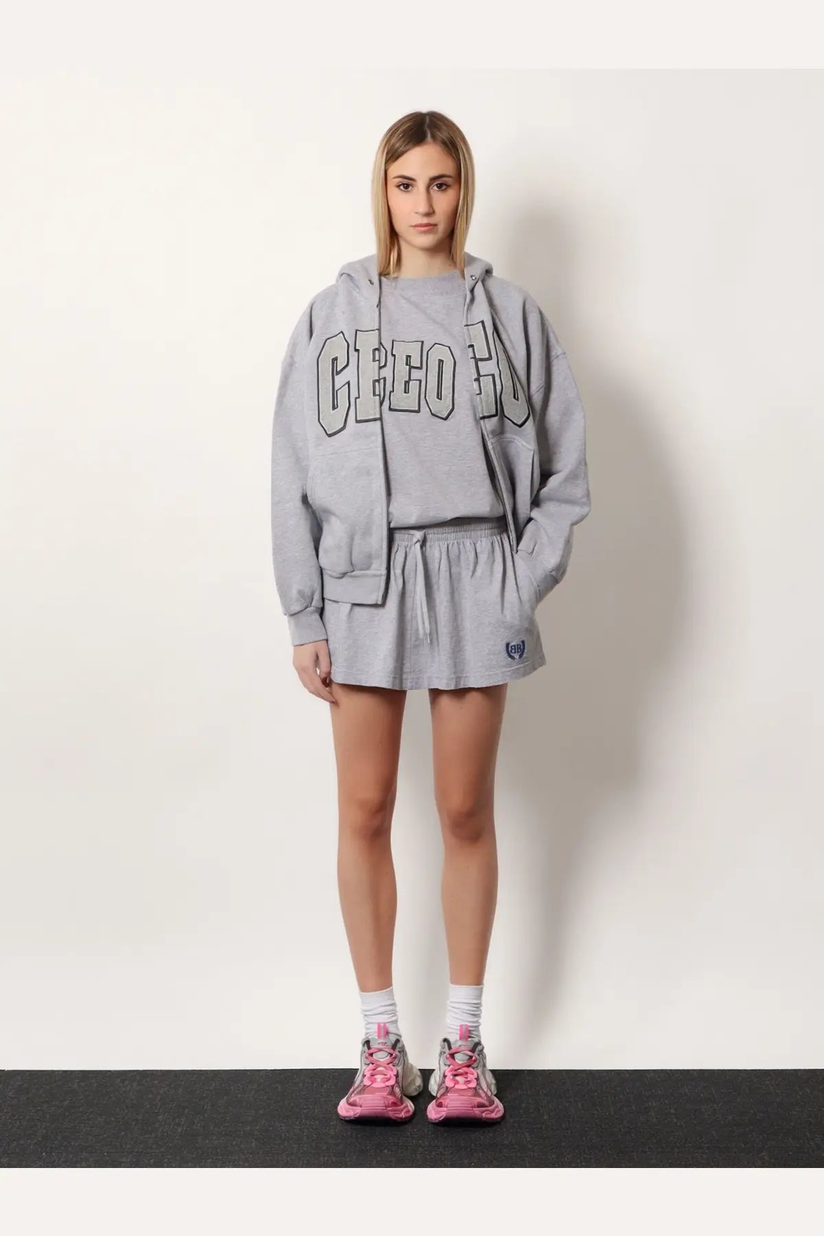 Balenciaga women’s grey cotton cropped hoodie with creep lettering and matching drawstring shorts shown from front