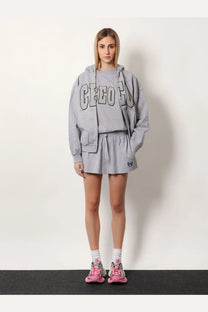 Balenciaga women’s grey cotton cropped hoodie with creep lettering and matching drawstring shorts shown from front