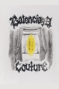White balenciaga women’s cotton shirt featuring a black sketch-style theater curtain illustration with a glowing yellow doorway