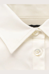 Balenciaga women’s white cotton shirt with a classic collar and subtle stitching details in a crisp button-down style